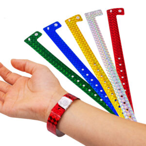 A *wristband* is a loop of material worn around the wrist, typically made from silicone, plastic, fabric, leather, or rubber. Wristbands serve various purposes, including: 1. *Identification*: Commonly used at events, hospitals, and theme parks for identification or as entry passes. 2. *Fashion*: Worn as a fashion accessory or to complement outfits. 3. *Support and Awareness*: Often used to show support for a cause, such as cancer awareness or charity campaigns (e.g., the popular "Livestrong" wristbands). 4. *Medical Alerts*: Some wristbands contain medical information (like allergies or medical conditions) to alert others in emergencies. 5. *Promotional Items*: Companies distribute branded wristbands as marketing tools to promote products, services, or events. 6. *Fitness and Health*: Modern wristbands, like fitness trackers, monitor physical activity, heart rate, and other health-related metrics. 7. *Security and Control*: Used for crowd control, like those with RFID (Radio-Frequency Identification) chips, which enable cashless transactions or access control. Their design and materials often vary depending on the purpose.